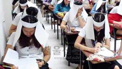 커닝 얼마나 심하길래…태국 대학 ‘커닝 방지 모자’ 화제